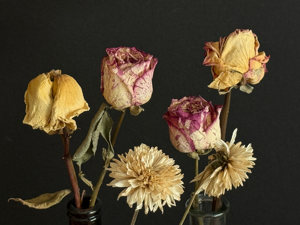 A bunch of flowers in a vase on a table